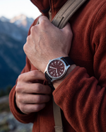 Clicöt Ares 41mm men's watch in red and black, worn on a man's left wrist