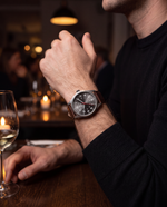 Close-up of the Clicöt Atlas 41mm watch in grey and brown on a man's left wrist