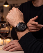 Clicöt Cronus 42mm men's watch in black, worn on a man's left wrist