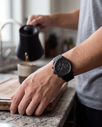 Close-up of the Clicöt Cronus 42mm watch in black on a man's left wrist