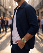 Clicöt Eclipse 42mm watch in green and gold on the left wrist, everyday lifestyle photo