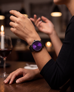 Clicöt Eris 36mm watch in black and purple on a woman's left wrist, everyday lifestyle photo