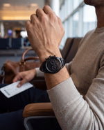 Clicöt Hades 42mm men's watch in black, worn on a man's left wrist
