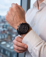 Close-up of the Clicöt Hades 42mm watch in black on a man's left wrist