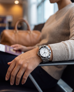 Clicöt Halo 42mm unisex watch in black, white and silver, worn on the left wrist