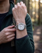 Clicöt Heaven 36mm watch in white on a woman's left wrist, everyday lifestyle photo