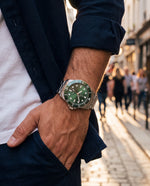 Clicöt Horizon 42mm unisex watch in green and silver, worn on the left wrist