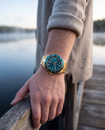 Clicöt Leo 42mm unisex watch in teal and gold, worn on the left wrist
