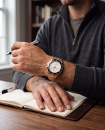 Clicöt Lumen 42mm unisex watch in black, white, gold and silver, worn on the left wrist