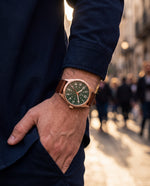 Clicöt Morpheus 41mm men's watch in green, brown and rose gold, worn on a man's left wrist