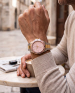 Clicöt Nova 42mm unisex watch in pink, gold and silver, worn on the left wrist