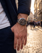 Clicöt Obsidian 42mm unisex watch in black and silver, worn on the left wrist