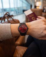 Clicöt Siren 36mm women's watch in black and red, worn on a woman's left wrist