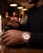 Clicöt Stella 42mm unisex watch in pink and silver, worn on the left wrist